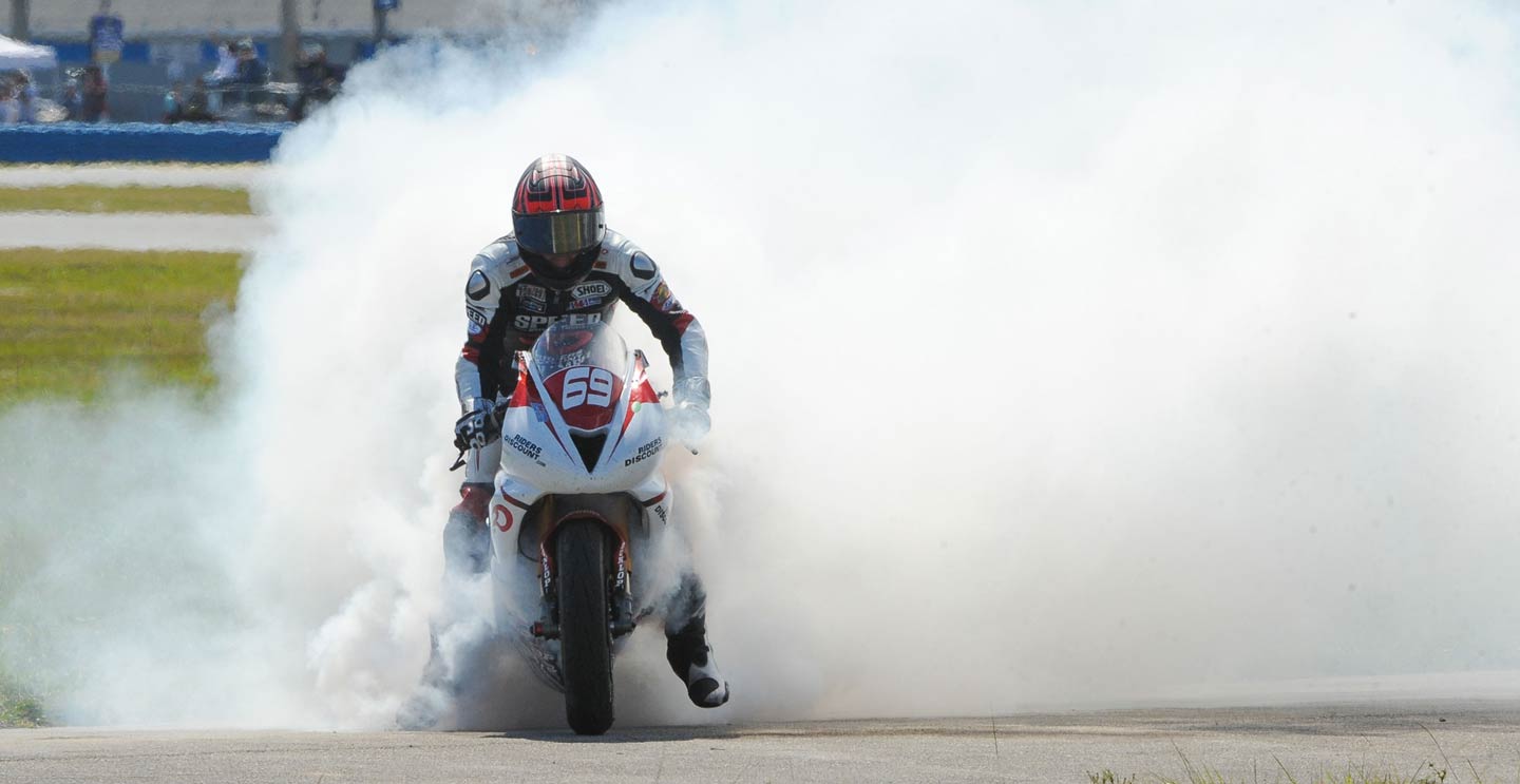 Riders Discount rider doing a burnout after winning the Daytona 200